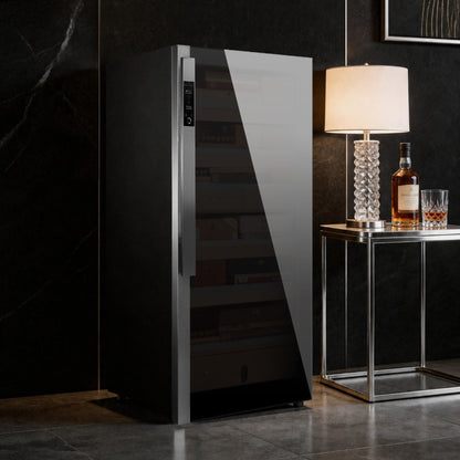 Raching DM52 Dark Matter cigar cabinet beside a whisky console