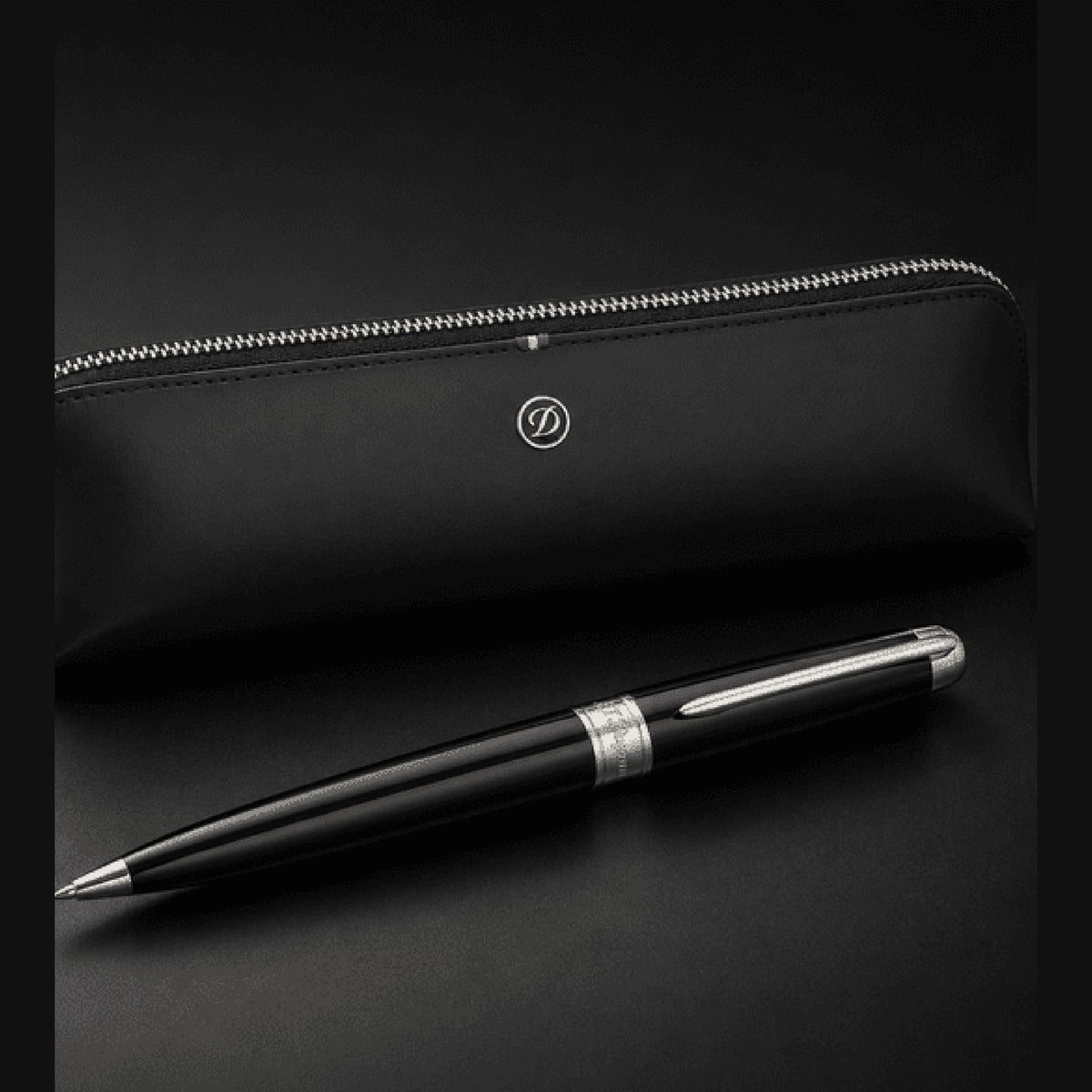 S.T. Dupont holiday set SET-BTS-01 - Line D Eternity large ballpoint pen in black lacquer and palladium beside a black leather pen pouch