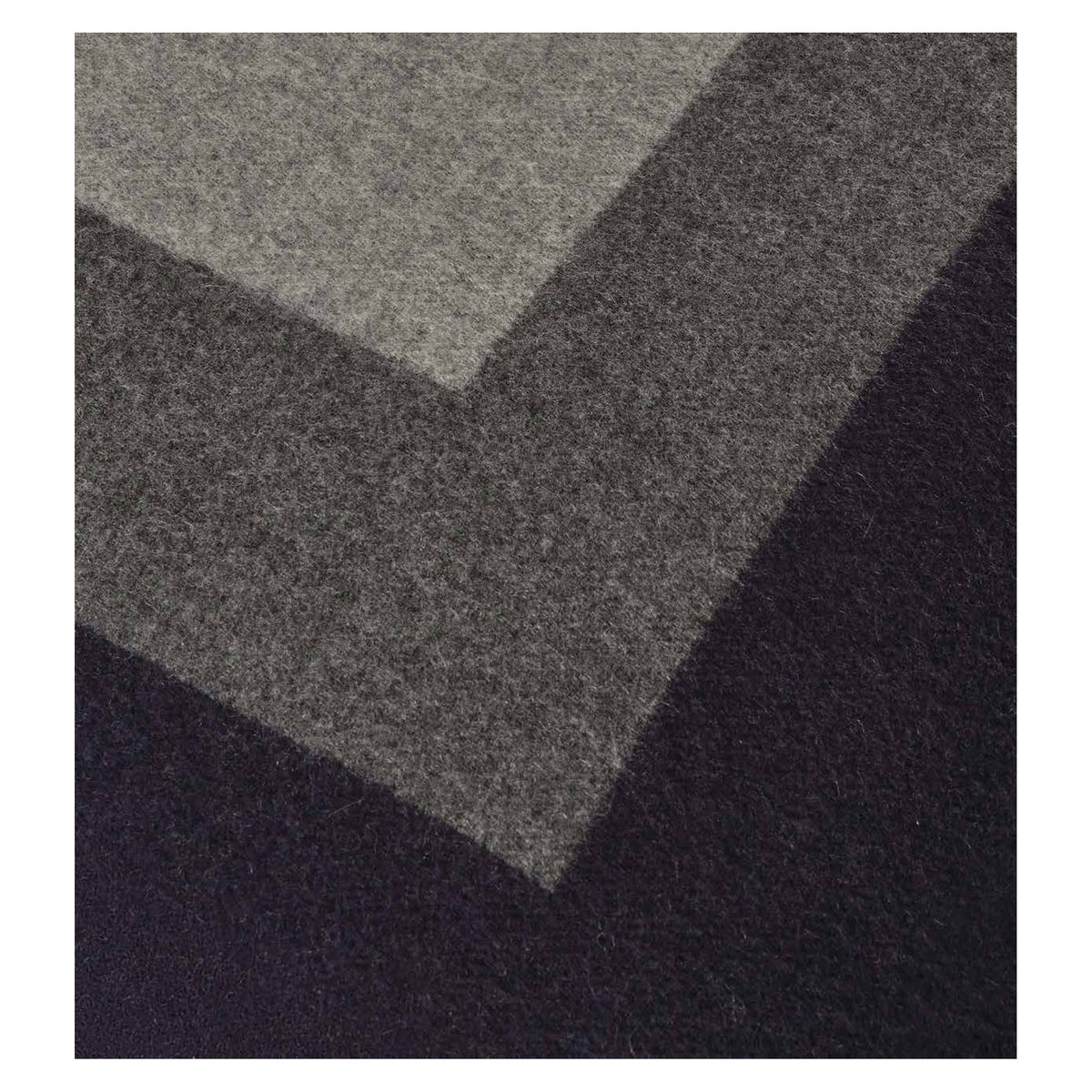 Johnstons of Elgin Art Geometric Cushion in Navy / Grey — close-up