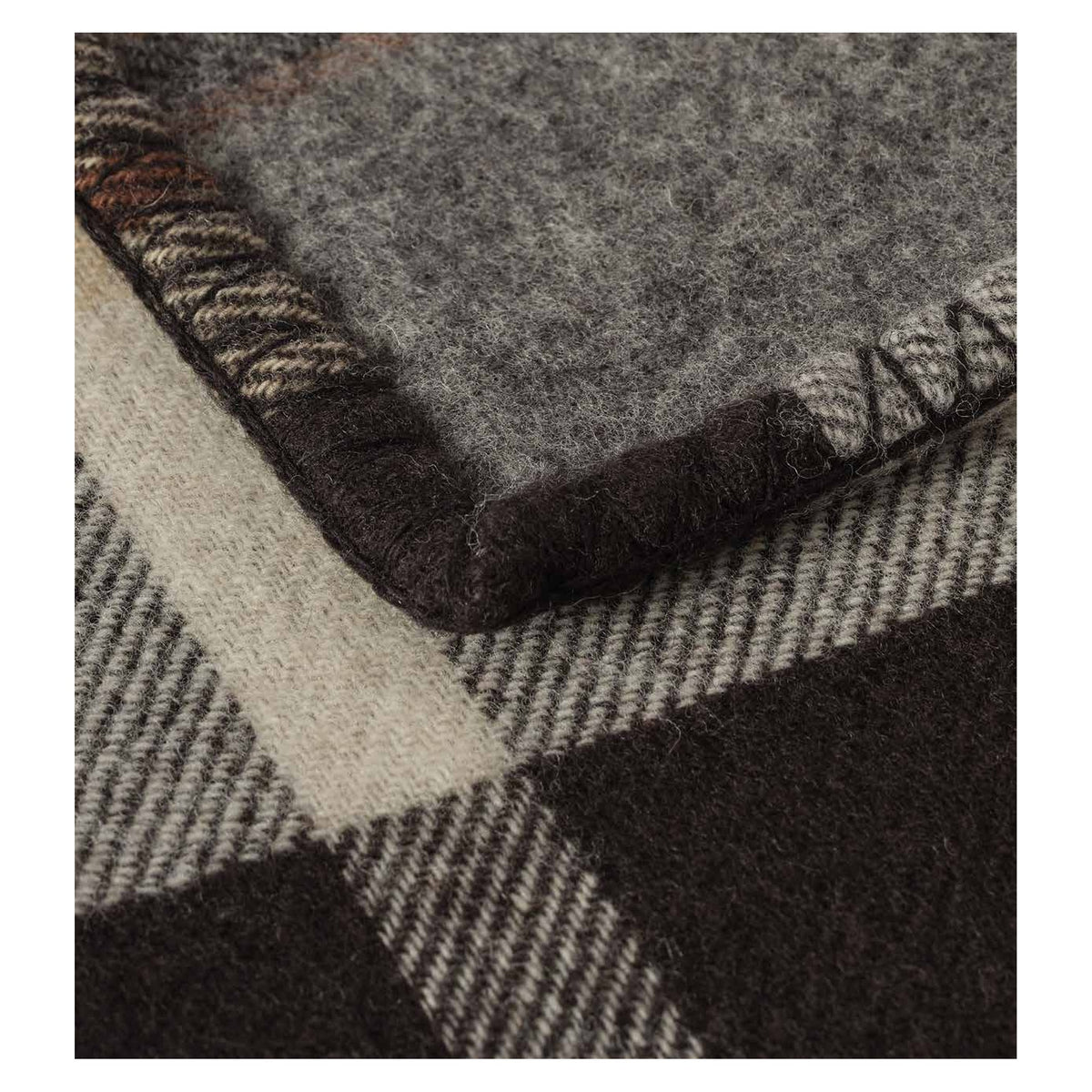 Johnstons of Elgin Blanket Stitched Doubleface Check Throw in Black with Brown Plaid — detail